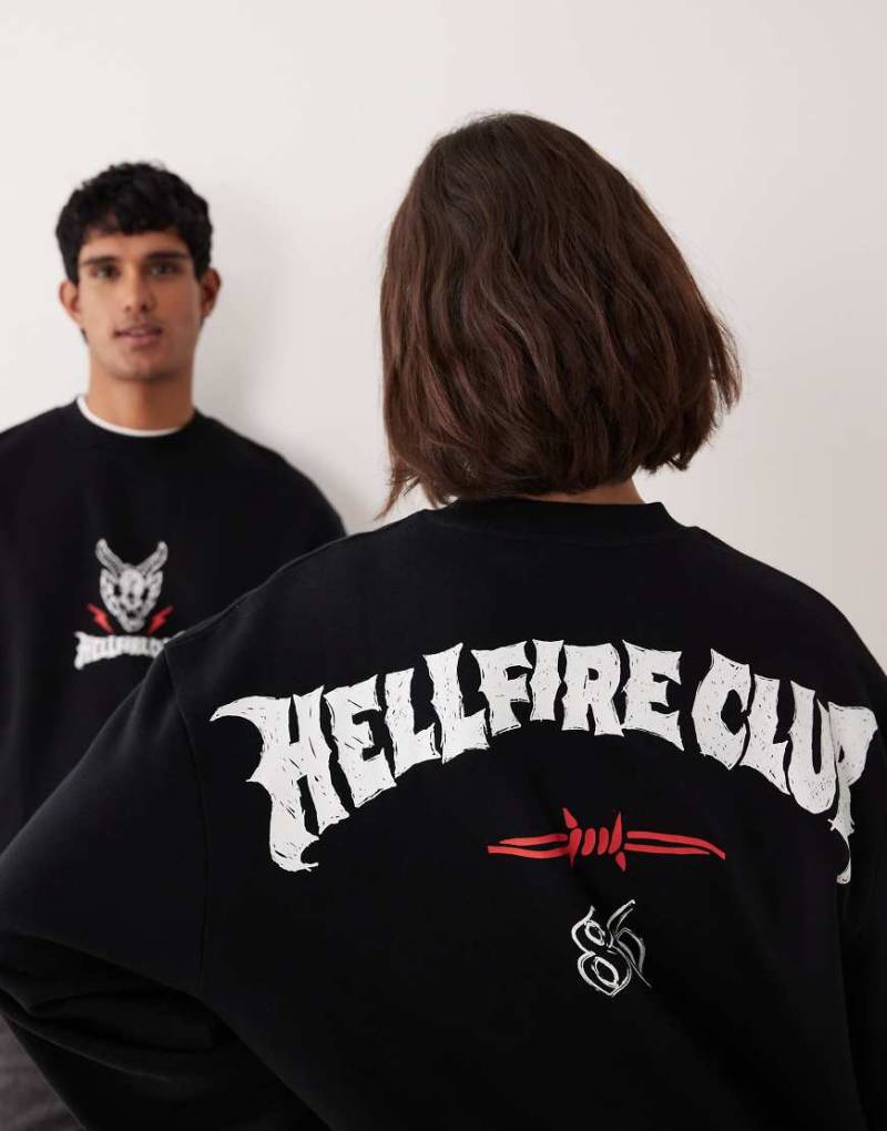 ASOS DESIGN - Locker geschnittenes Unisex-Sweatshirt in Schwarz mit Stranger Things-Grafiken von ASOS DESIGN