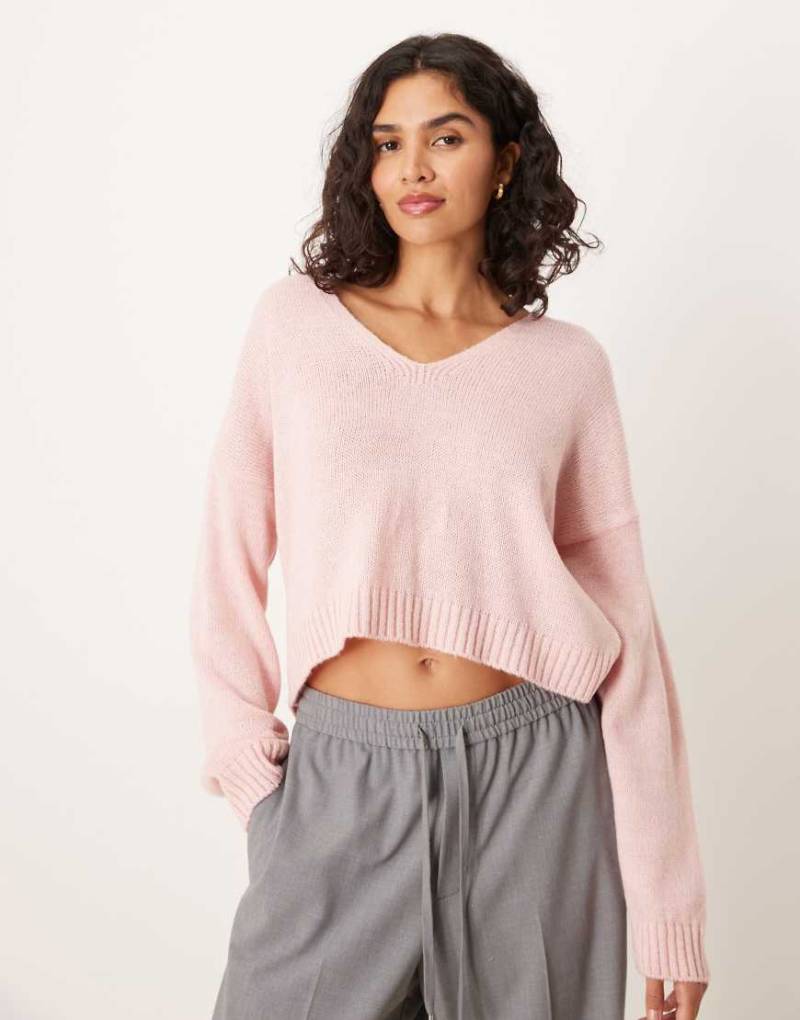 ASOS DESIGN - Lockerer Strickpullover in Rosa mit V-Ausschnitt von ASOS DESIGN