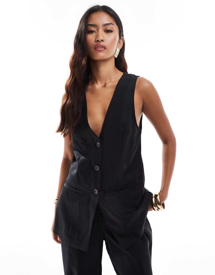 ASOS DESIGN - Longline-Weste in verwaschenem Schwarz, Kombiteil ASOS DESIGN - Longline-Weste in verwaschenem Schwarz, Kombiteil von ASOS DESIGN