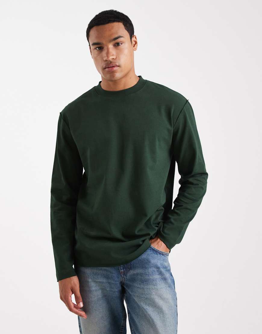 ASOS DESIGN - M WORLD - Langärmliges Relaxed-Fit-Shirt aus schwerem Stoff in Dunkelgrün mit offenem Saum von ASOS DESIGN