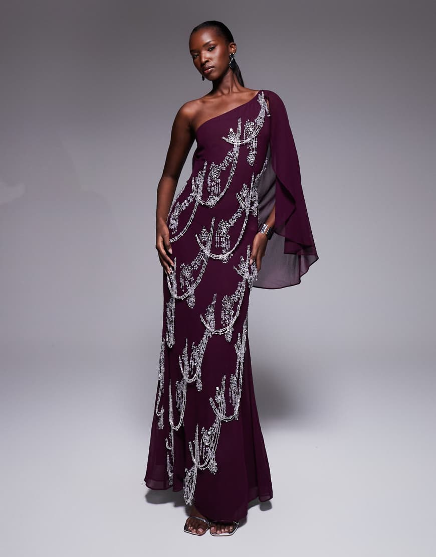 ASOS DESIGN - Maxikleid in Pflaumenlila mit Schrägschnitt, Fransenverzierung und Cape-Ärmeln ASOS DESIGN - Maxikleid in Pflaumenlila mit Schrägschnitt, Fransenverzierung und Cape-Ärmeln von ASOS DESIGN