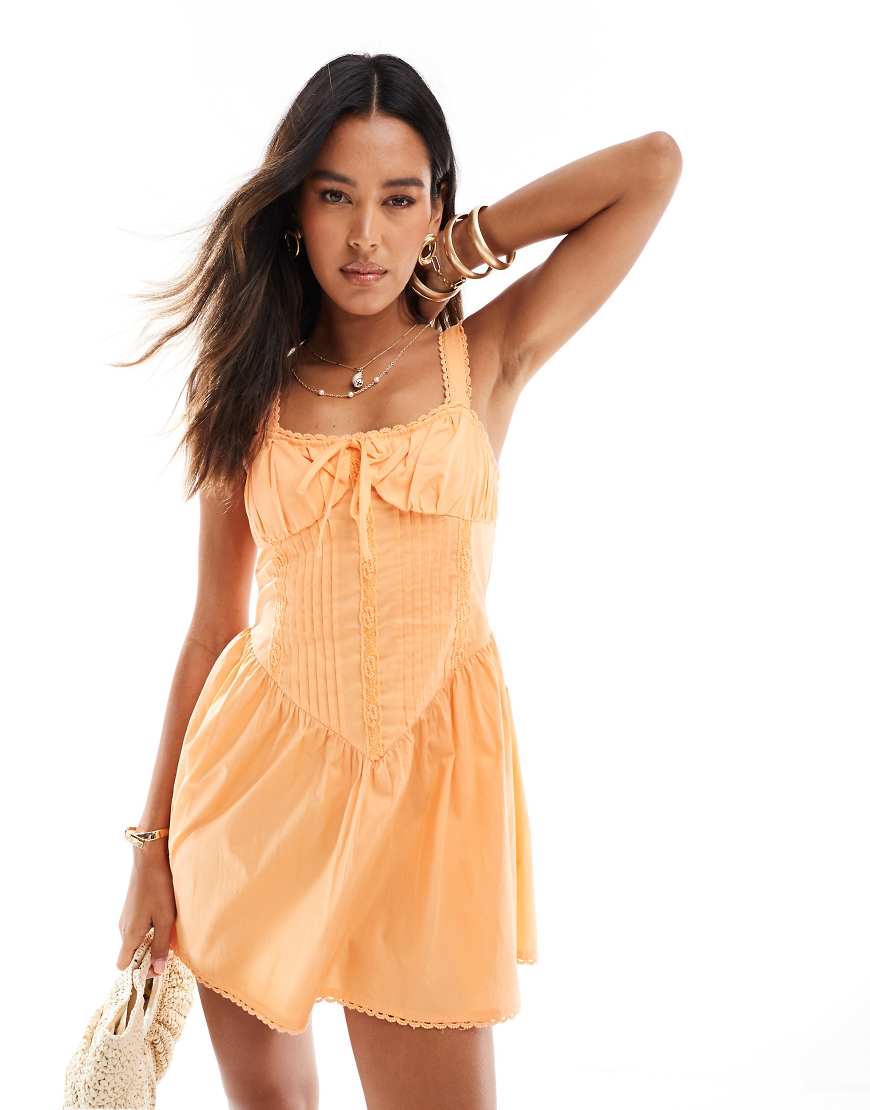 ASOS DESIGN - Mini-Sommerkleid in verwaschenem Orange mit Korsett-Oberteil und Spitzenbesatz von ASOS DESIGN