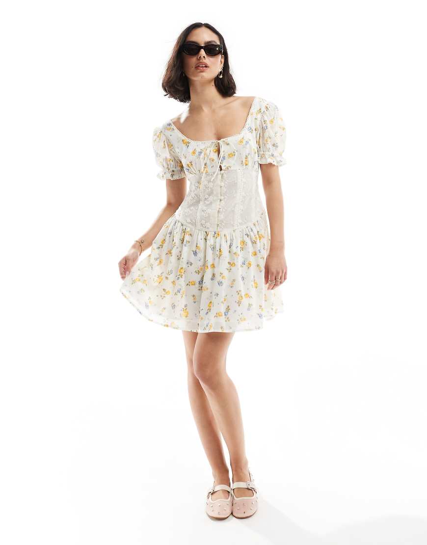ASOS DESIGN - Minikleid mit Blumenprint in Blau und Zitronengelb, Puffärmeln und Spitze an der Taille-Bunt ASOS DESIGN - Minikleid mit Blumenprint in Blau und Zitronengelb, Puffärmeln und Spitze an der Taille-Bunt von ASOS DESIGN