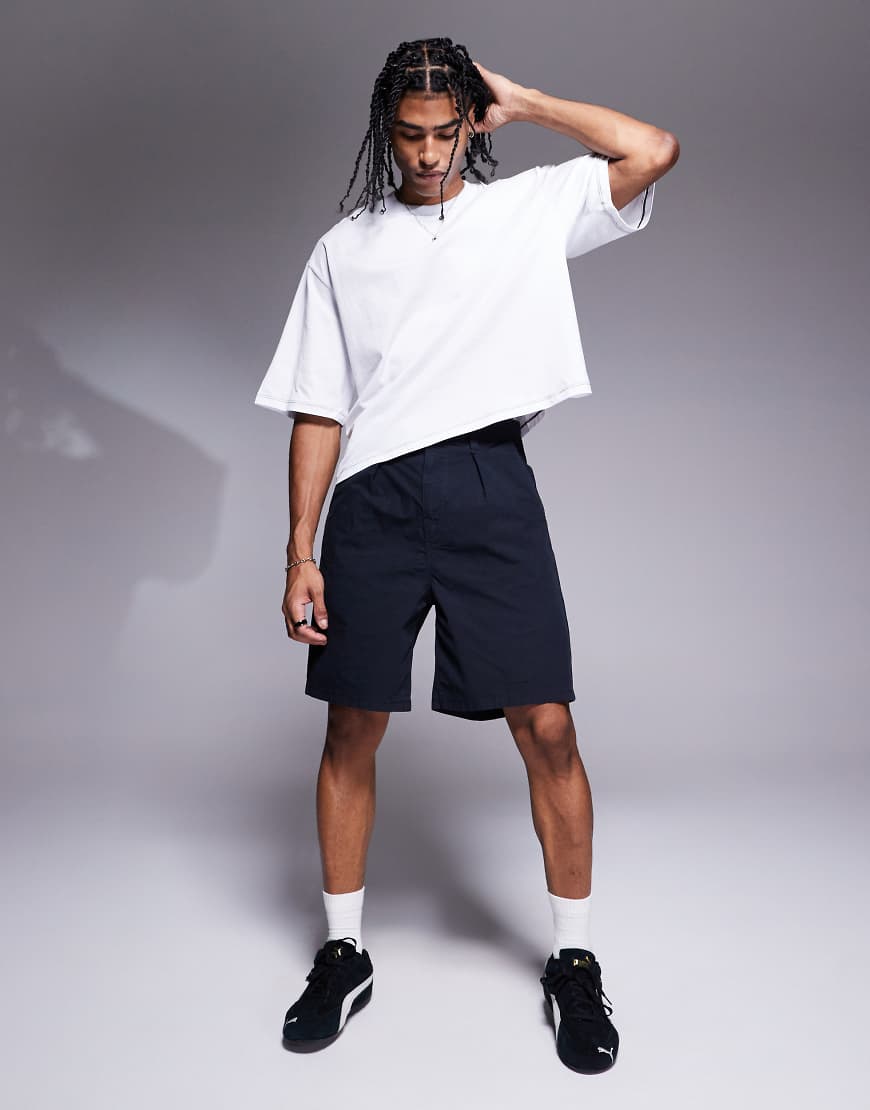 ASOS DESIGN - Shorts in Marineblau in mittlerer Länge mit Bundfalten ASOS DESIGN - Shorts in Marineblau in mittlerer Länge mit Bundfalten von ASOS DESIGN