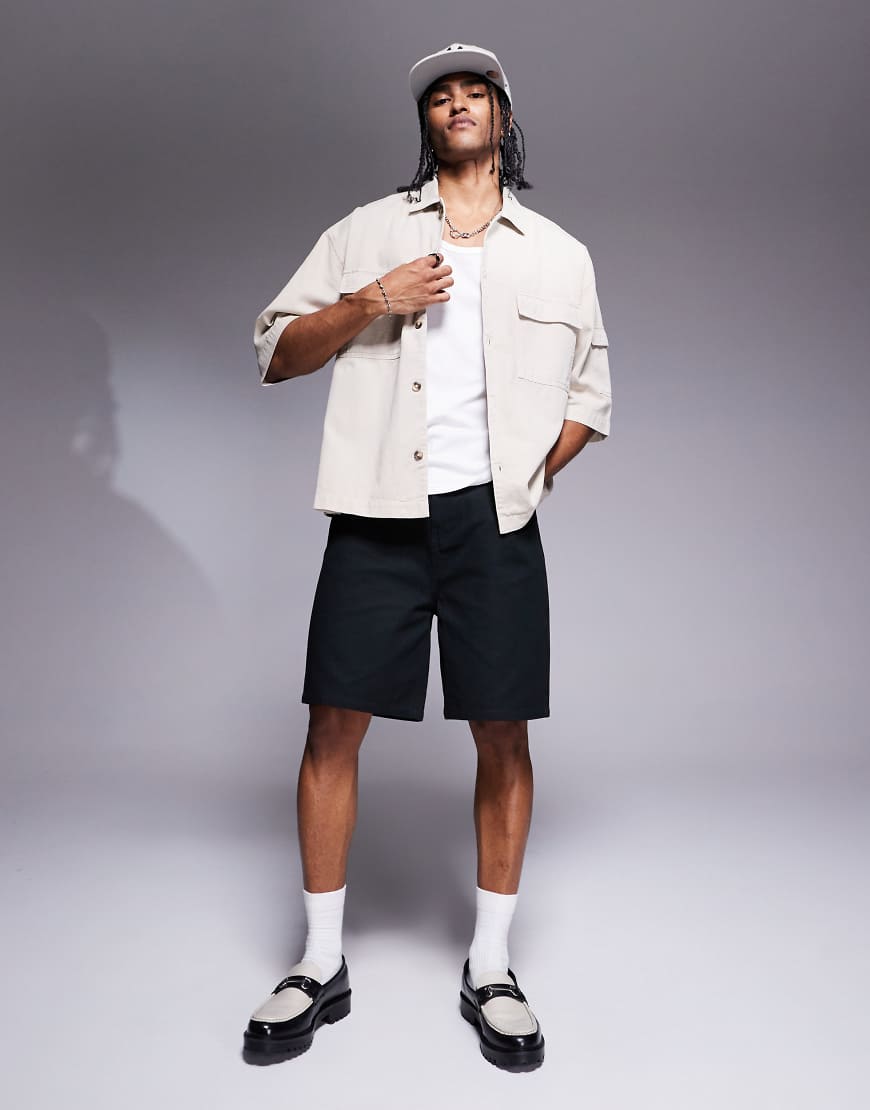 ASOS DESIGN - Mittellange Shorts in Schwarz von ASOS DESIGN