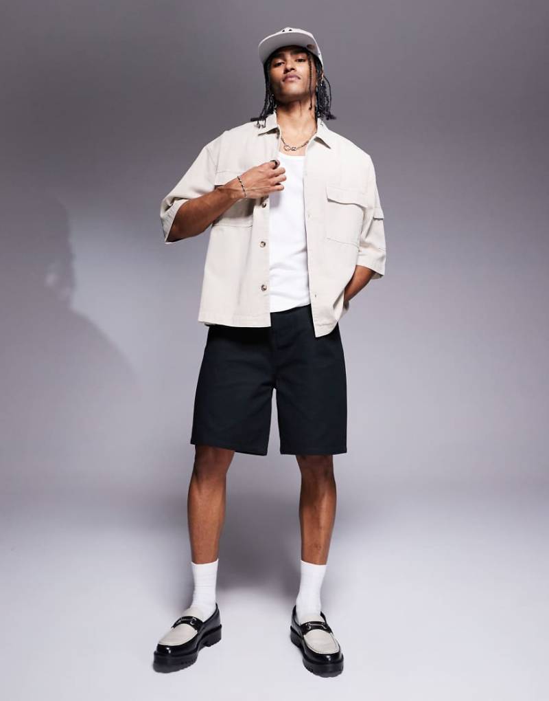 ASOS DESIGN - Mittellange Shorts in Schwarz von ASOS DESIGN