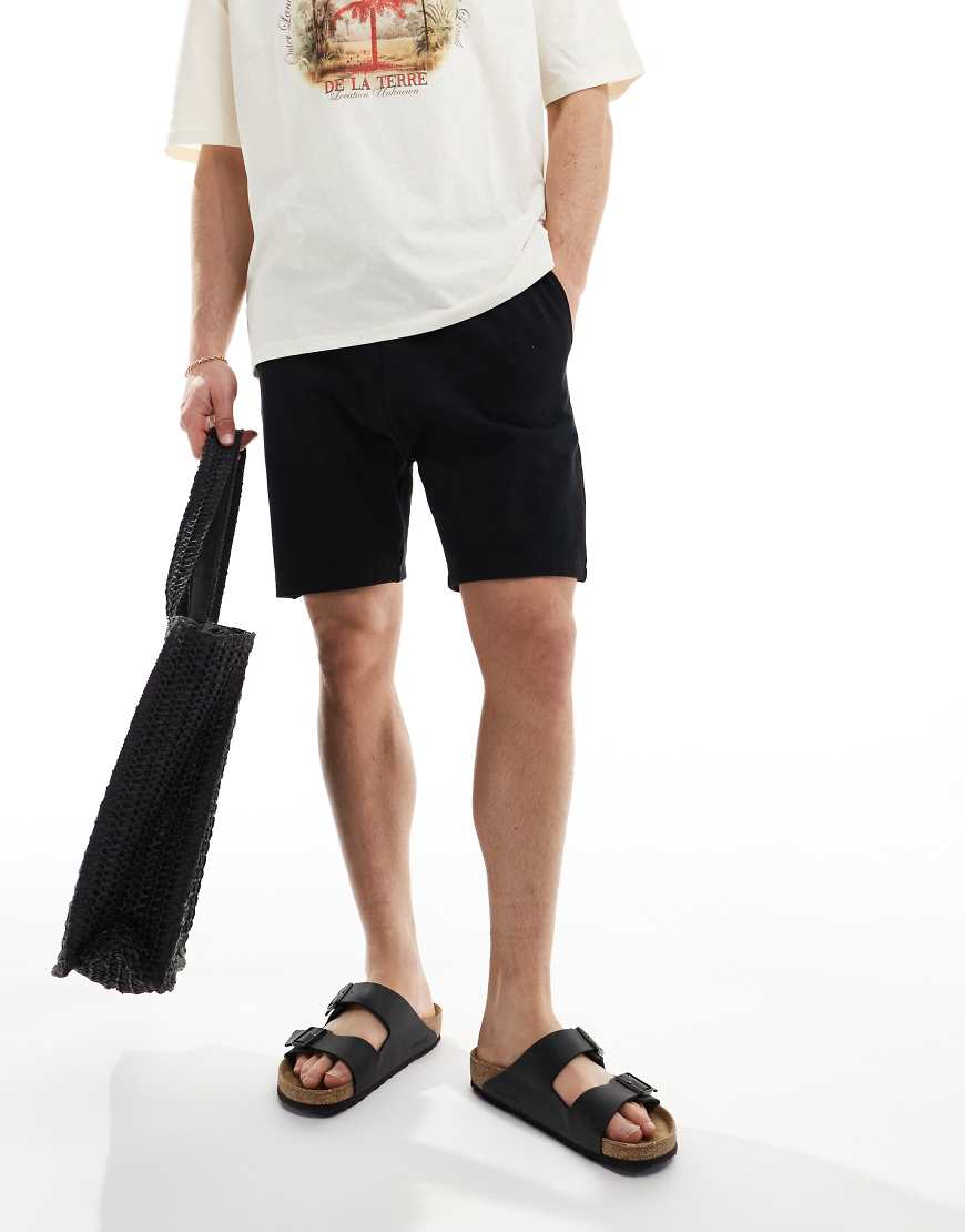 ASOS DESIGN - Mittellange Shorts in Schwarz mit engem Schnitt ASOS DESIGN - Mittellange Shorts in Schwarz mit engem Schnitt von ASOS DESIGN