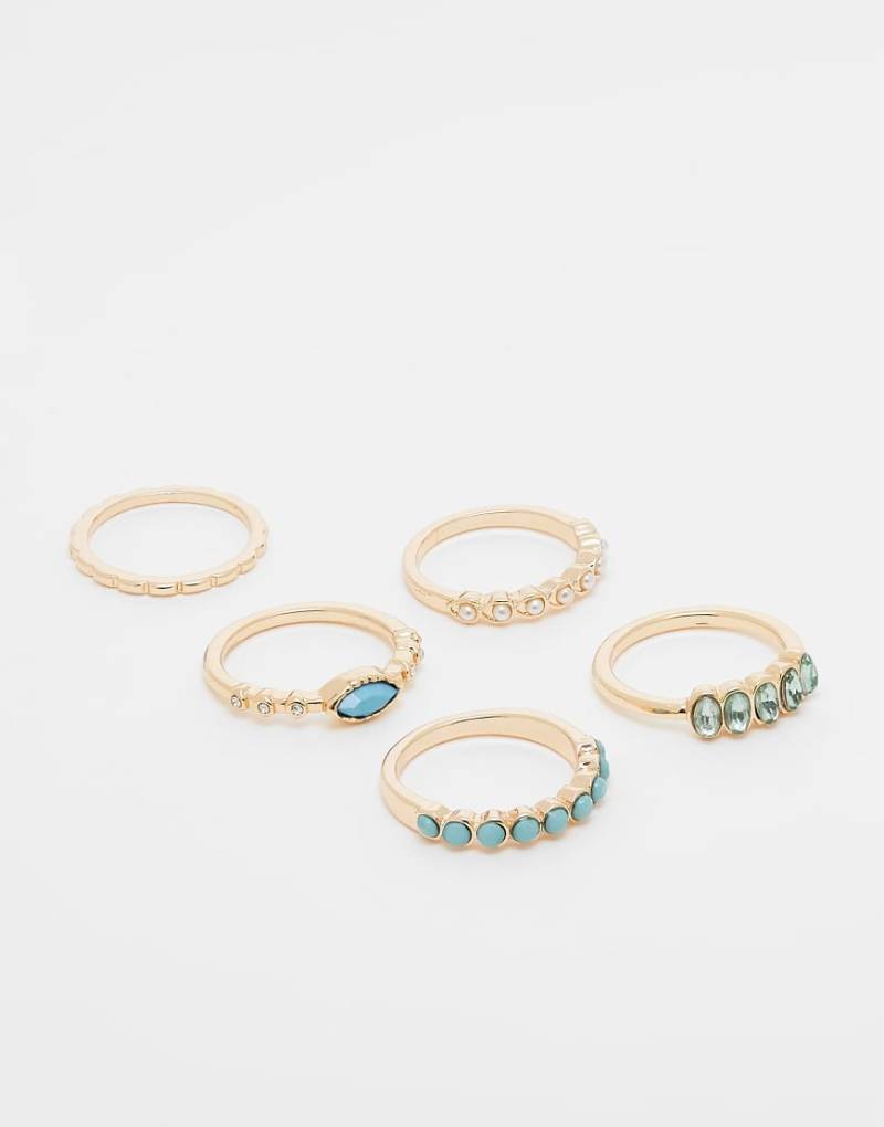 ASOS DESIGN - Multipack goldfarbener Ringe in verschiedenen Designs, mit blauen Schmucksteinen und Zierperlen von ASOS DESIGN