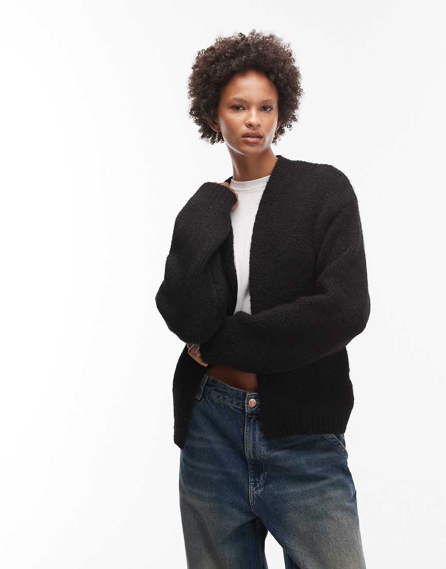 ASOS DESIGN - Offene Strickjacke in Schwarz mit Wollanteil ASOS DESIGN - Offene Strickjacke in Schwarz mit Wollanteil von ASOS DESIGN