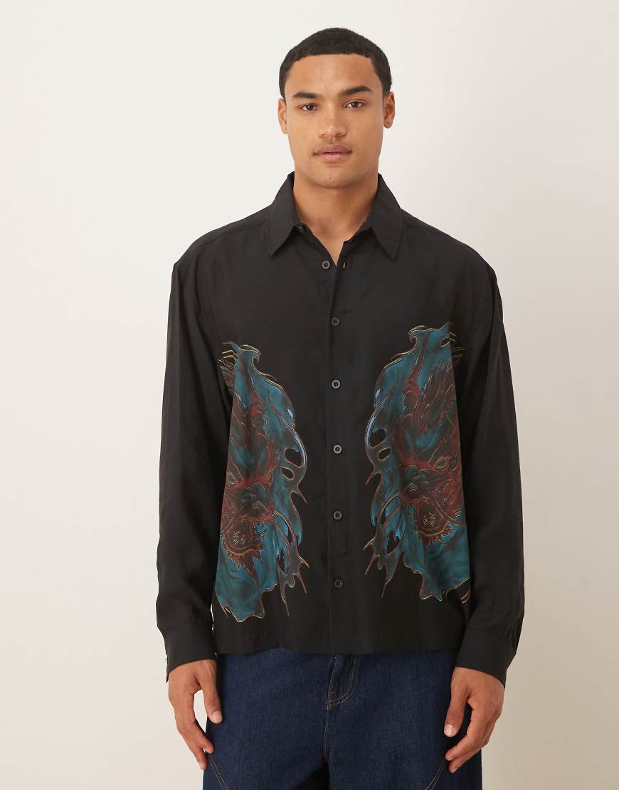 ASOS DESIGN - Oversize-Hemd in Schwarz mit eckigem Kragen und Drachenprint ASOS DESIGN - Oversize-Hemd in Schwarz mit eckigem Kragen und Drachenprint von ASOS DESIGN
