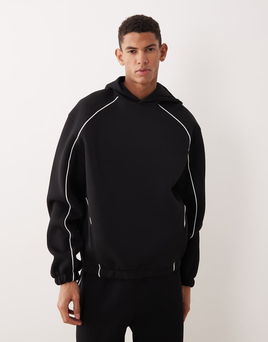 ASOS DESIGN - Oversize-Kapuzenpullover aus schwerem, neoprenartigem Material in Schwarz mit Paspelierung von ASOS DESIGN