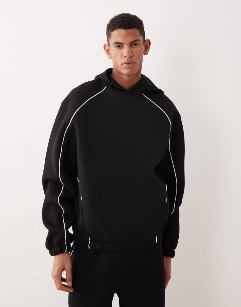 ASOS DESIGN - Oversize-Kapuzenpullover aus schwerem, neoprenartigem Material in Schwarz mit Paspelierung von ASOS DESIGN
