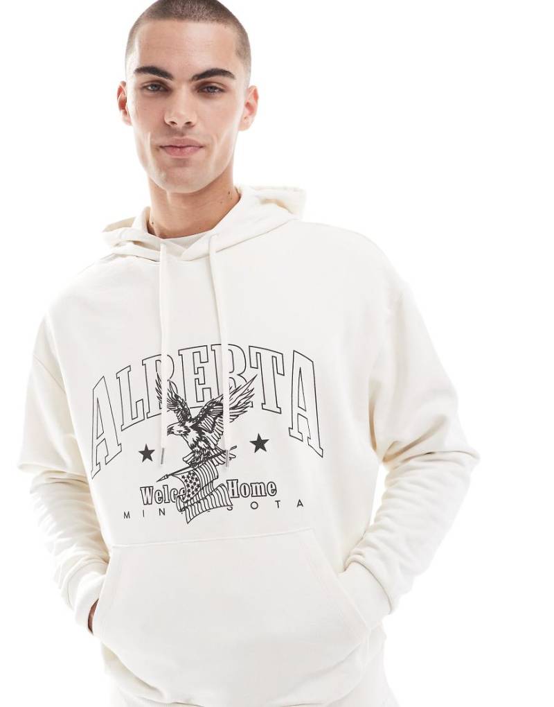 ASOS DESIGN - Oversize-Kapuzenpullover in Creme mit Print auf Brusthöhe-Weiß von ASOS DESIGN
