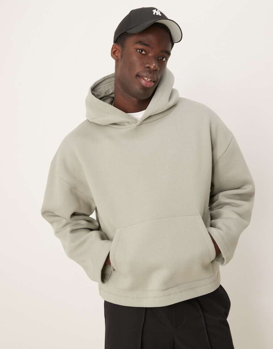 ASOS DESIGN - Oversize-Kapuzenpullover in Khaki mit festem Saum-Grün ASOS DESIGN - Oversize-Kapuzenpullover in Khaki mit festem Saum-Grün von ASOS DESIGN