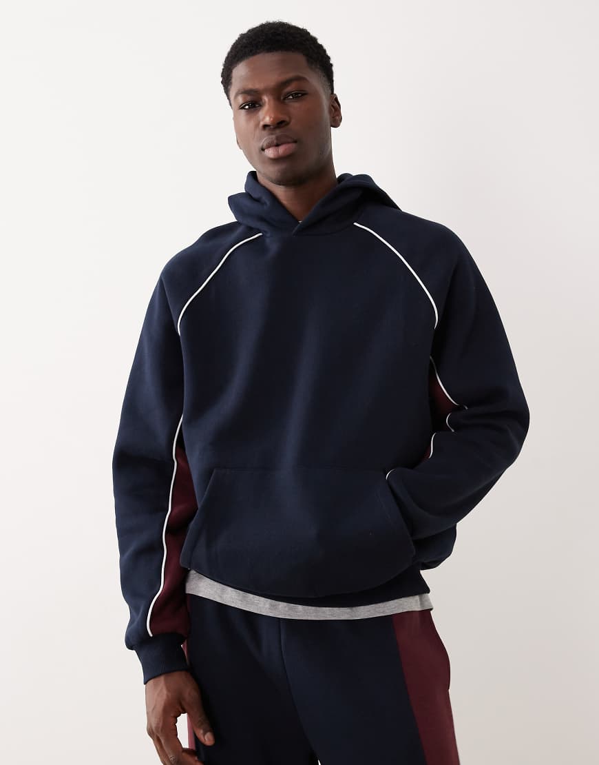 ASOS DESIGN - Oversize-Kapuzenpullover in Marineblau mit abgenähtem Bahnendesign, Kombiteil ASOS DESIGN - Oversize-Kapuzenpullover in Marineblau mit abgenähtem Bahnendesign, Kombiteil von ASOS DESIGN