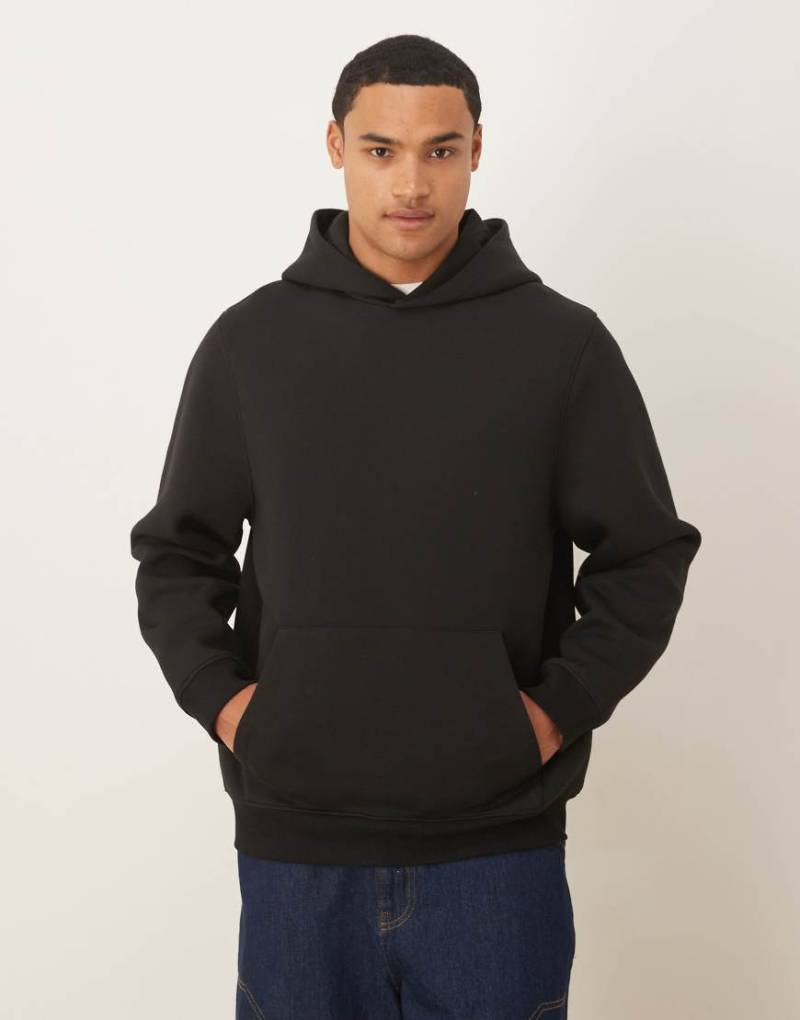 ASOS DESIGN - Locker geschnittener Kapuzenpullover aus schwerem, neoprenartigem Stoff in Schwarz von ASOS DESIGN