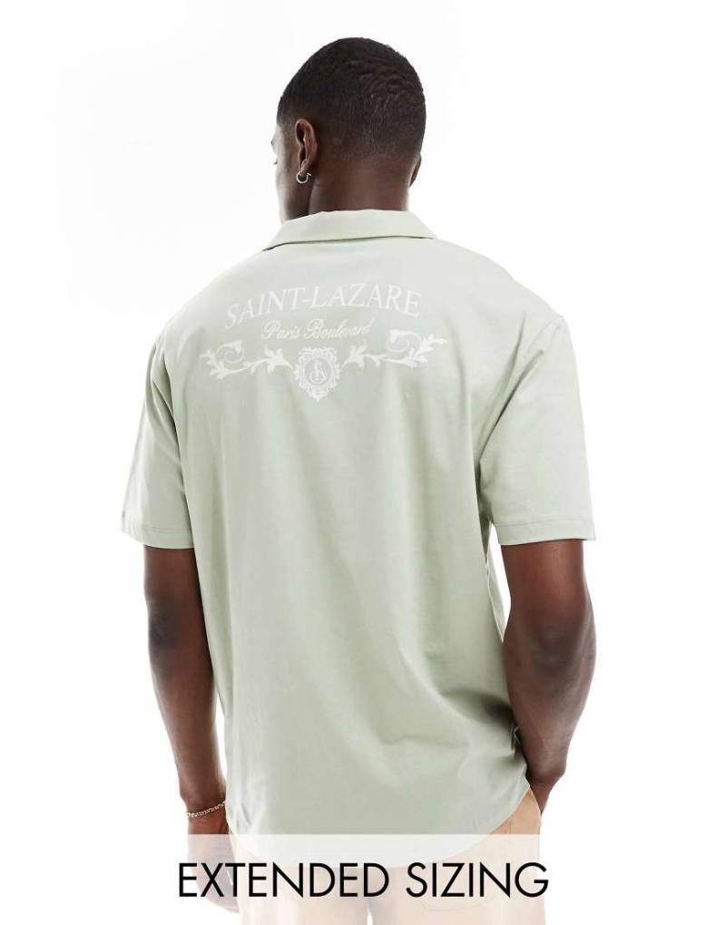 ASOS DESIGN - Oversize-Polohemd in Hellgrün mit Rückenprint von ASOS DESIGN
