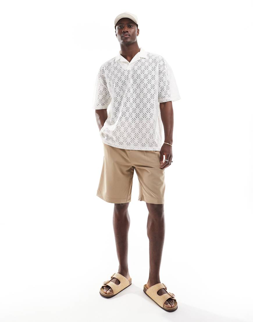 ASOS DESIGN - Oversize-Polohemd in gebrochenem Weiß mit Häkelstruktur und Reverskragen ASOS DESIGN - Oversize-Polohemd in gebrochenem Weiß mit Häkelstruktur und Reverskragen von ASOS DESIGN