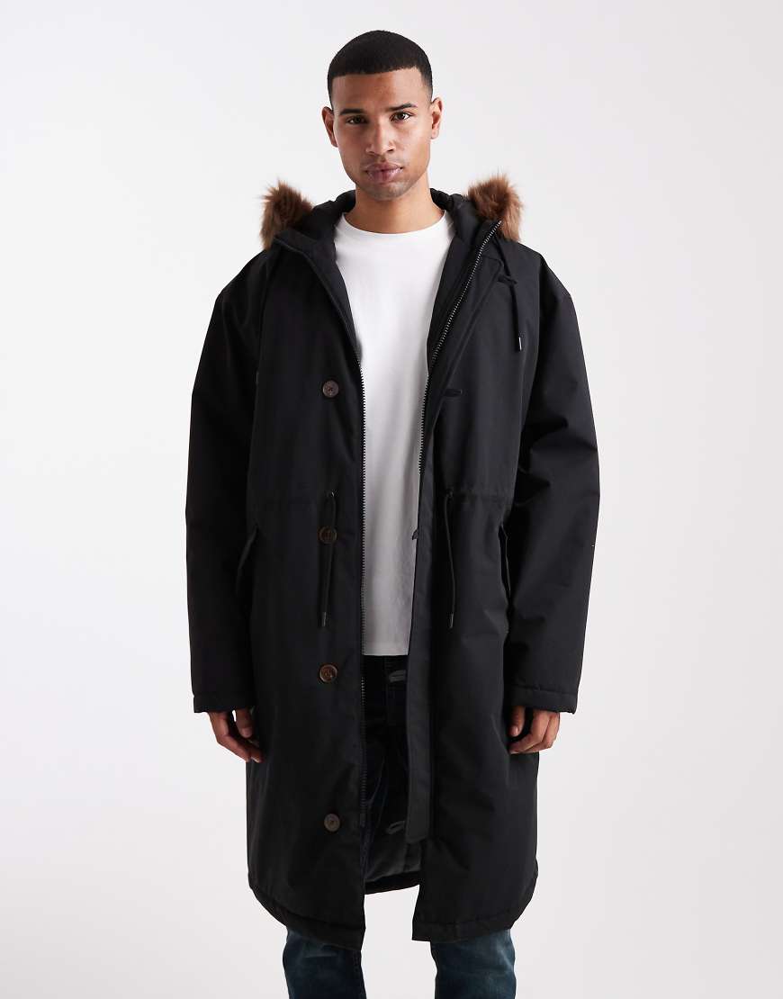 ASOS DESIGN - Oversize-Pufferjacke in Schwarz mit Kunstpelz-Kapuze von ASOS DESIGN