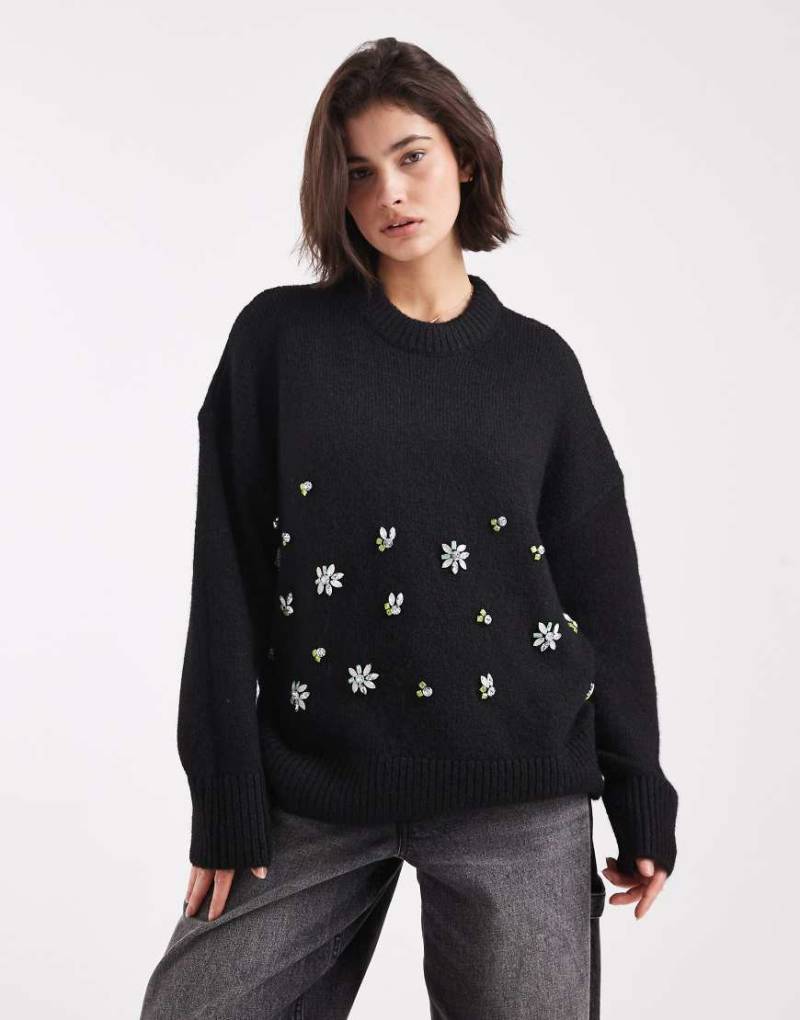 ASOS DESIGN - Oversize-Pullover in Schwarz mit Blumenverzierung von ASOS DESIGN