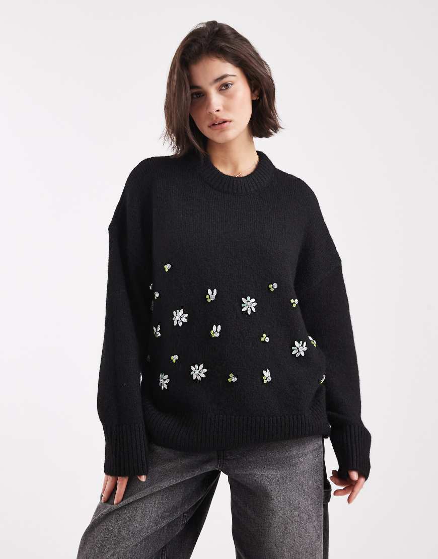ASOS DESIGN - Oversize-Pullover in Schwarz mit Blumenverzierung von ASOS DESIGN