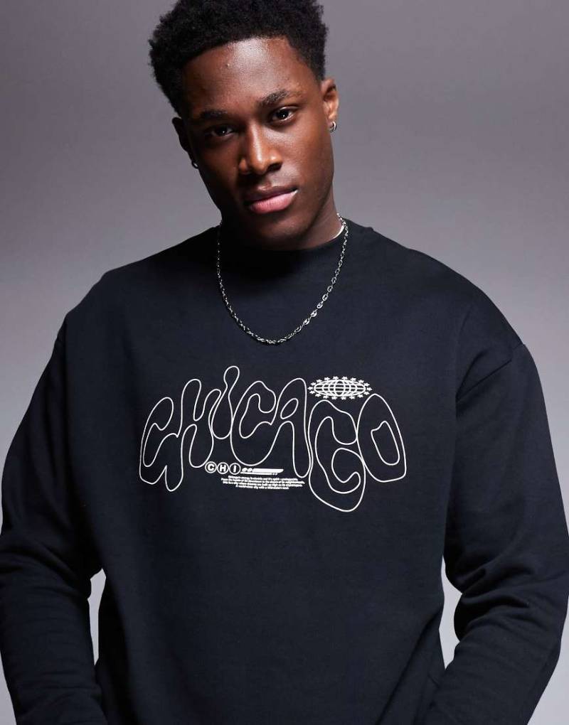 ASOS DESIGN - Oversize-Pullover in Schwarz mit Rundhalsausschnitt und City-Print von ASOS DESIGN