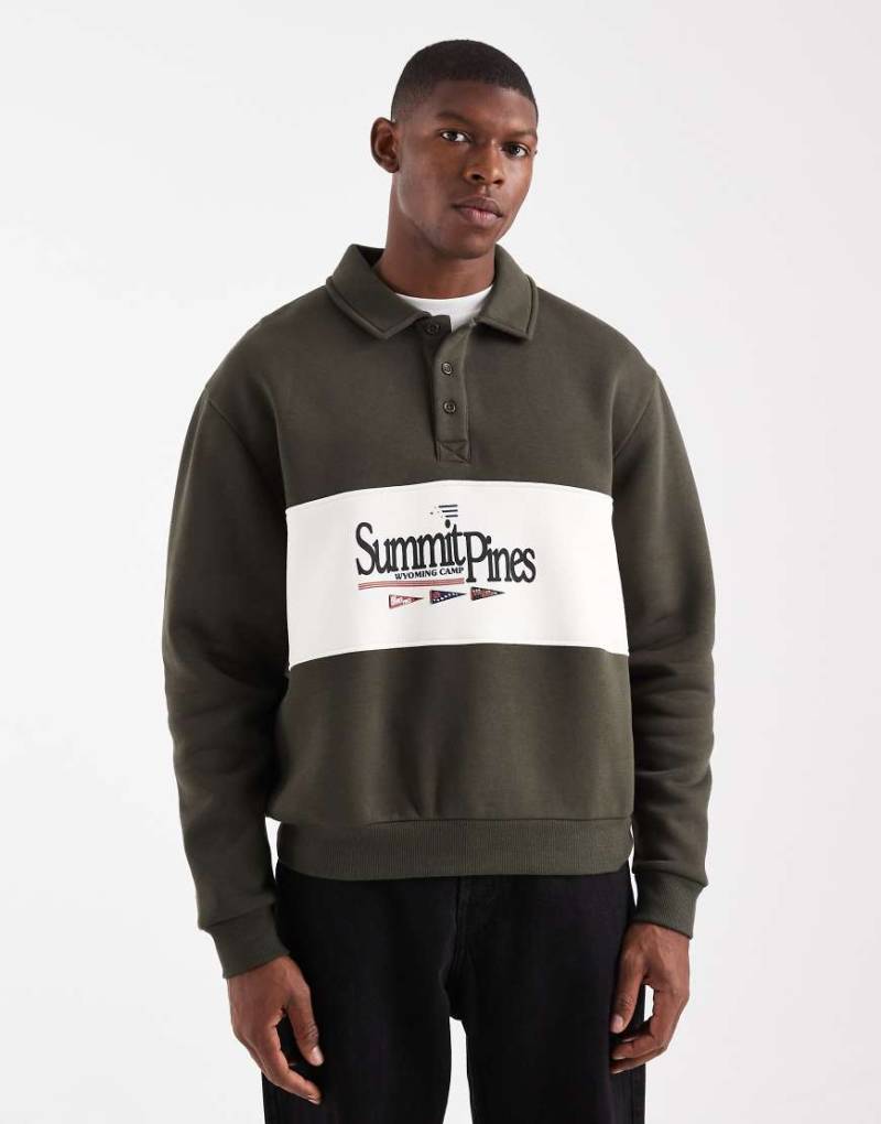ASOS DESIGN - Oversize-Rugby-Sweatshirt in Grün mit Polokragen, Farbblock-Design und Print von ASOS DESIGN