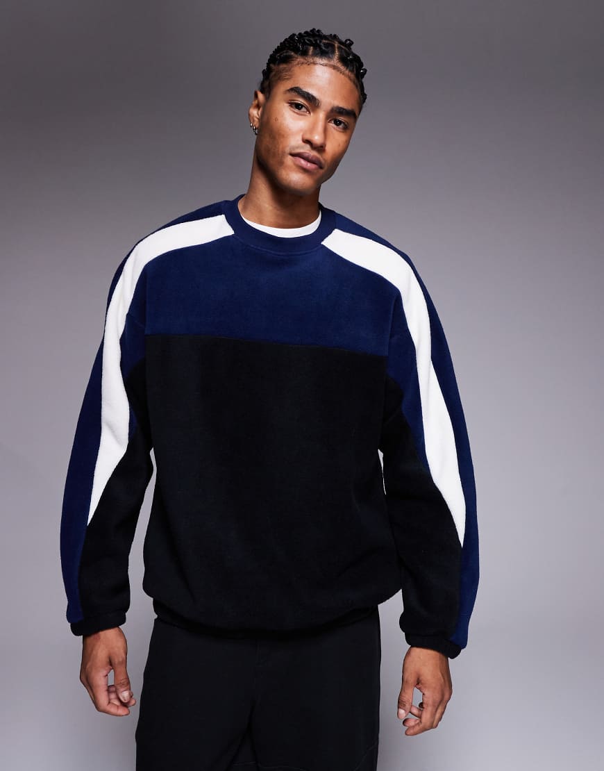 ASOS DESIGN - Locker geschnittenes Fleece-Sweatshirt in Schwarz mit Colourblock-Design von ASOS DESIGN