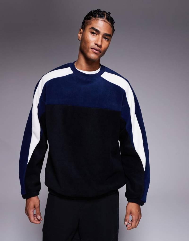 ASOS DESIGN - Locker geschnittenes Fleece-Sweatshirt in Schwarz mit Colourblock-Design ASOS DESIGN - Locker geschnittenes Fleece-Sweatshirt in Schwarz mit Colourblock-Design von ASOS DESIGN