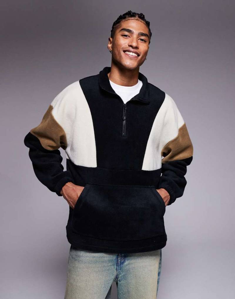 ASOS DESIGN - Oversize-Sweatshirt aus Fleece mit Trichterausschnitt und kurzem Reißverschluss und Farbblockdesign in Schwarz von ASOS DESIGN