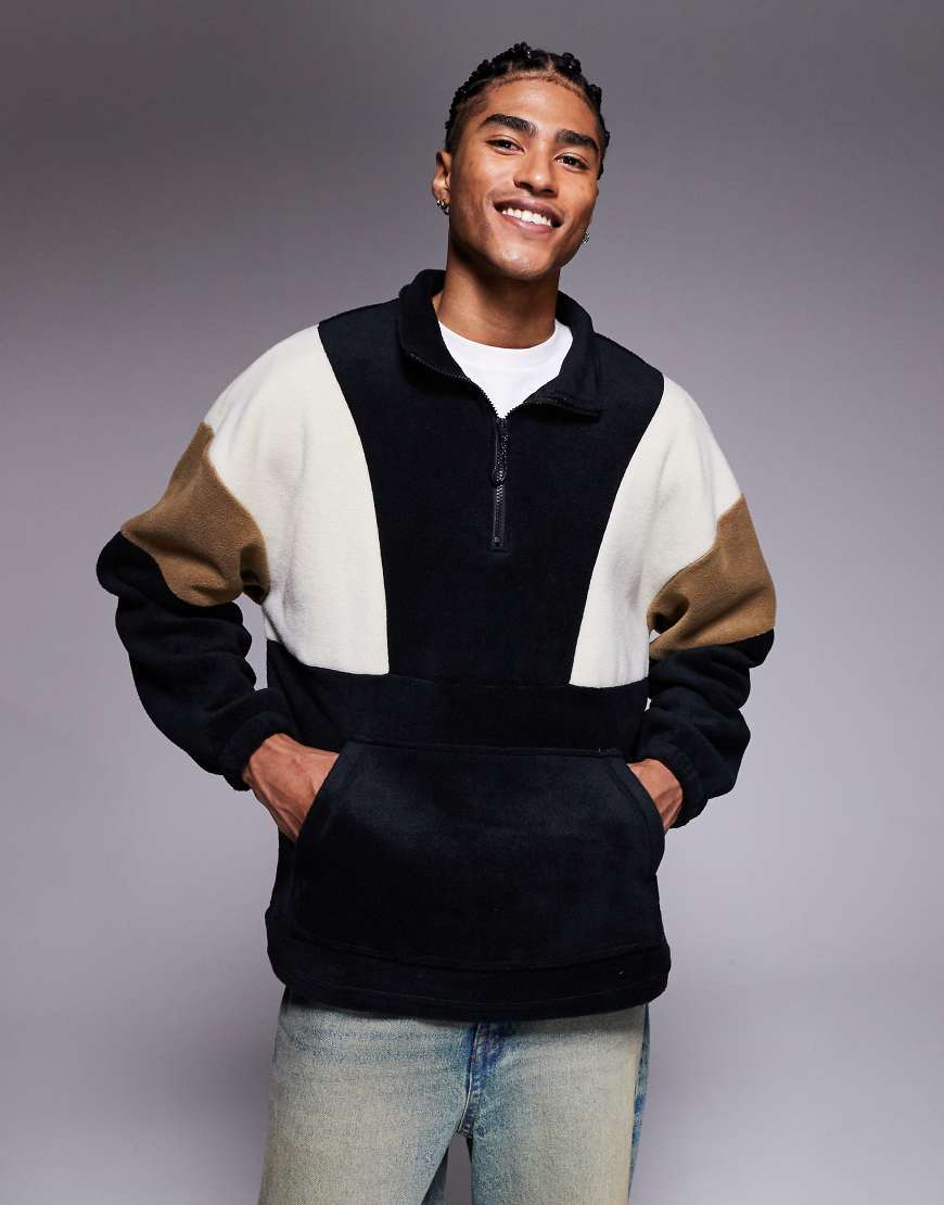 ASOS DESIGN - Oversize-Sweatshirt aus Fleece mit Trichterausschnitt und kurzem Reißverschluss und Farbblockdesign in Schwarz von ASOS DESIGN