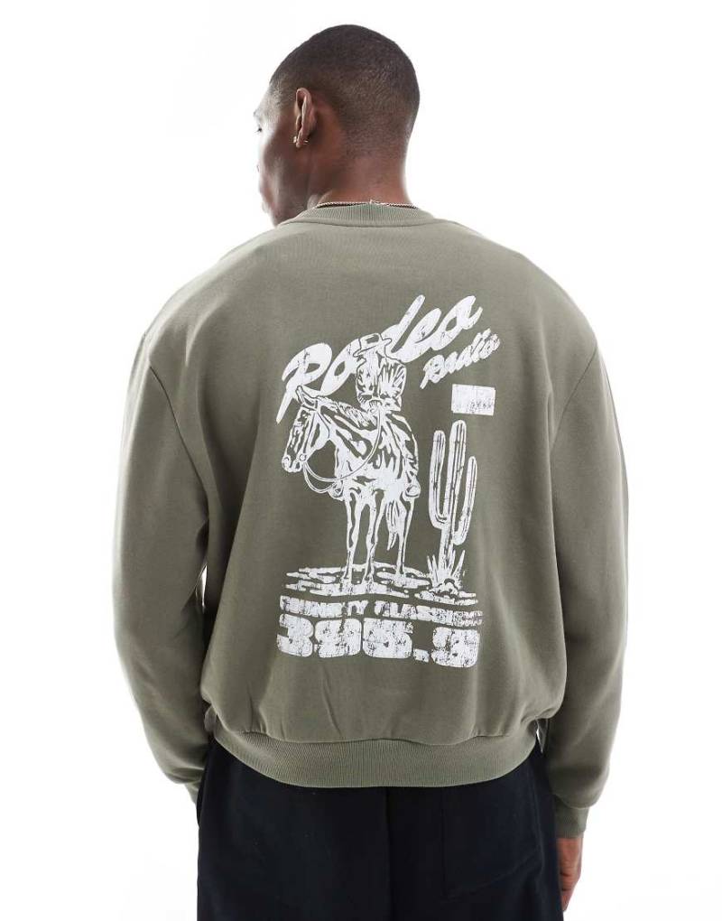 ASOS DESIGN - Oversize-Sweatshirt in Khaki mit Print-Grün von ASOS DESIGN