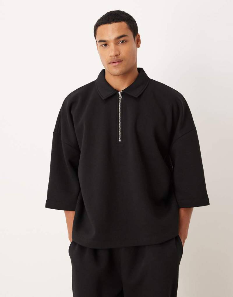 ASOS DESIGN - Locker geschnittenes Sweatshirt in Schwarz mit Dreiviertelärmeln, kurzem Reißverschluss und Kragen von ASOS DESIGN