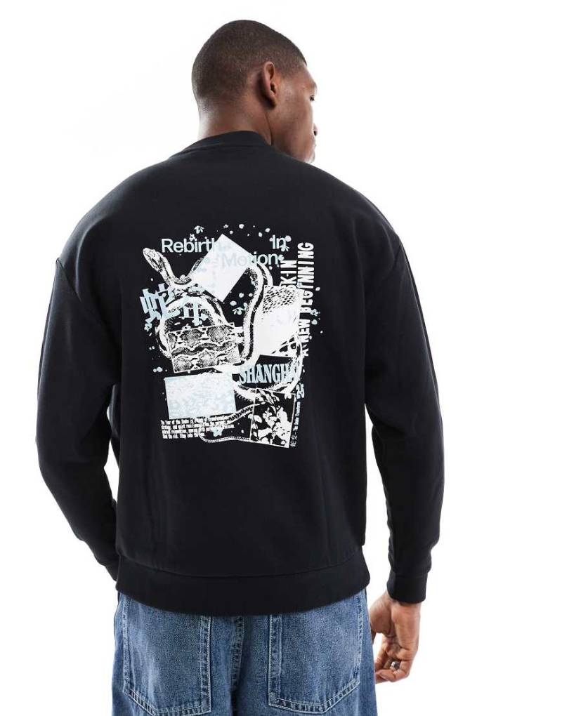ASOS DESIGN - Oversize-Sweatshirt in Schwarz mit Prints von ASOS DESIGN
