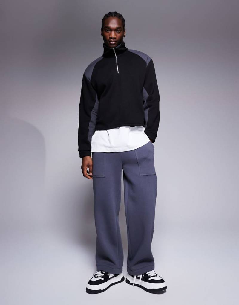 ASOS DESIGN - Oversize-Sweatshirt in Schwarz mit kastigem Schnitt, tief angesetzten Schultern, Stehkragen und Nyloneinsätzen von ASOS DESIGN