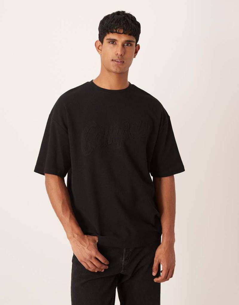 ASOS DESIGN - Oversize-T-Shirt aus schwerem Stoff mit Waffelstruktur und Textapplikation-Grau von ASOS DESIGN