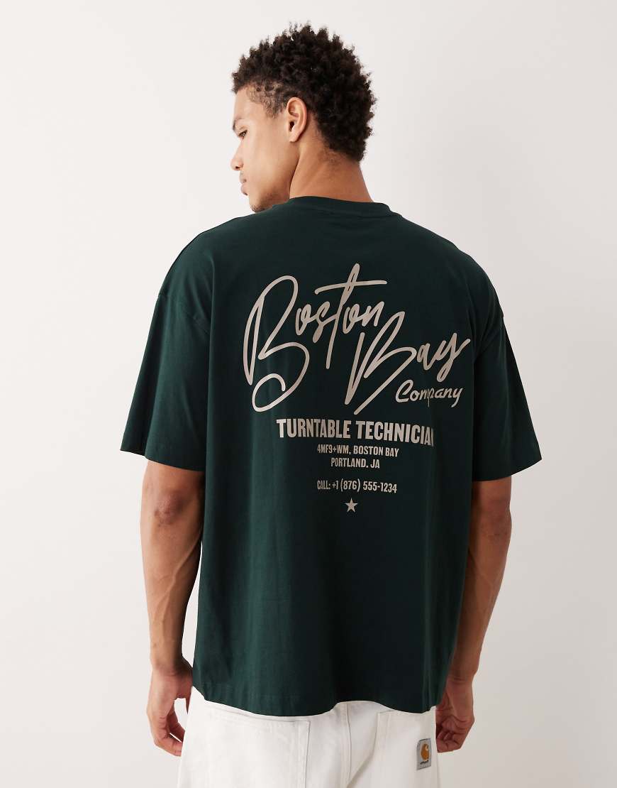 ASOS DESIGN - Oversize-T-Shirt in Dunkelgrün mit City-Textgrafikprint von ASOS DESIGN
