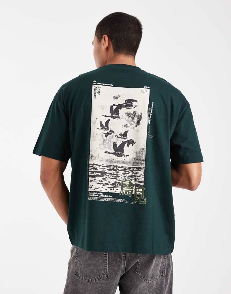 ASOS DESIGN - Oversize-T-Shirt in Dunkelgrün mit Souvenir-Print von ASOS DESIGN
