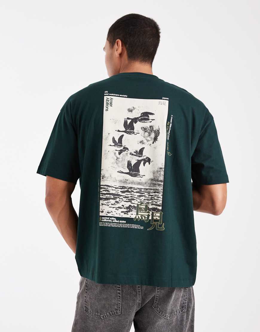 ASOS DESIGN - Oversize-T-Shirt in Dunkelgrün mit Souvenir-Print von ASOS DESIGN