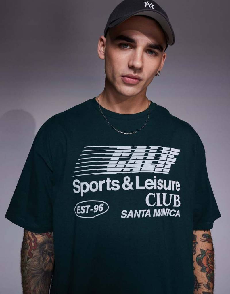 ASOS DESIGN - Oversize-T-Shirt in Grün mit „Sports Club"-Print vorn von ASOS DESIGN