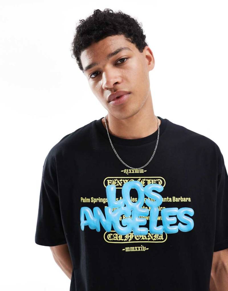 ASOS DESIGN - Oversize-T-Shirt in Schwarz mit City-Print vorn von ASOS DESIGN