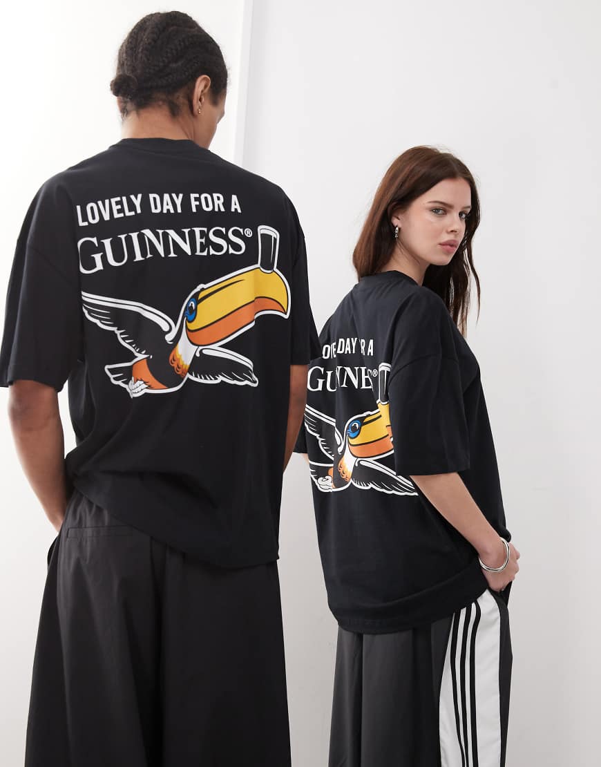 ASOS DESIGN - Oversize-T-Shirt in Schwarz mit Unisex-Schnitt und „Guinness"-Prints von ASOS DESIGN