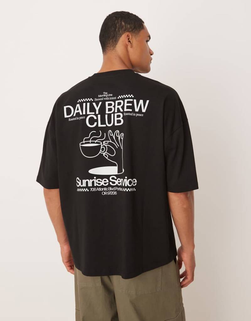 ASOS DESIGN - Oversize-T-Shirt in Schwarz mit überschnittenen Schultern und Aufdruck von ASOS DESIGN