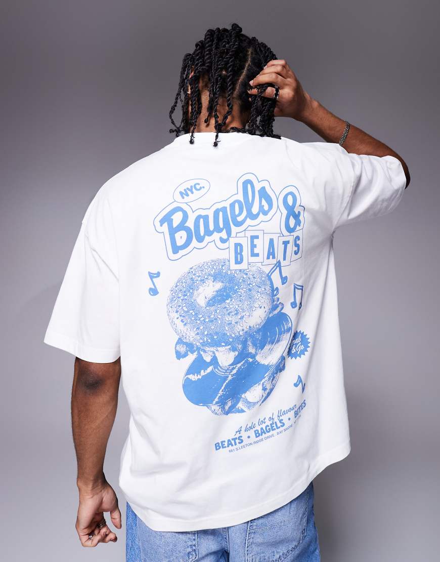 ASOS DESIGN - Oversize-T-Shirt in Weiß mit Cartoon-Print ASOS DESIGN - Oversize-T-Shirt in Weiß mit Cartoon-Print von ASOS DESIGN