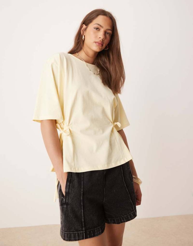 ASOS DESIGN - Oversize-T-Shirt in Zitronengelb mit Bindedetail von ASOS DESIGN