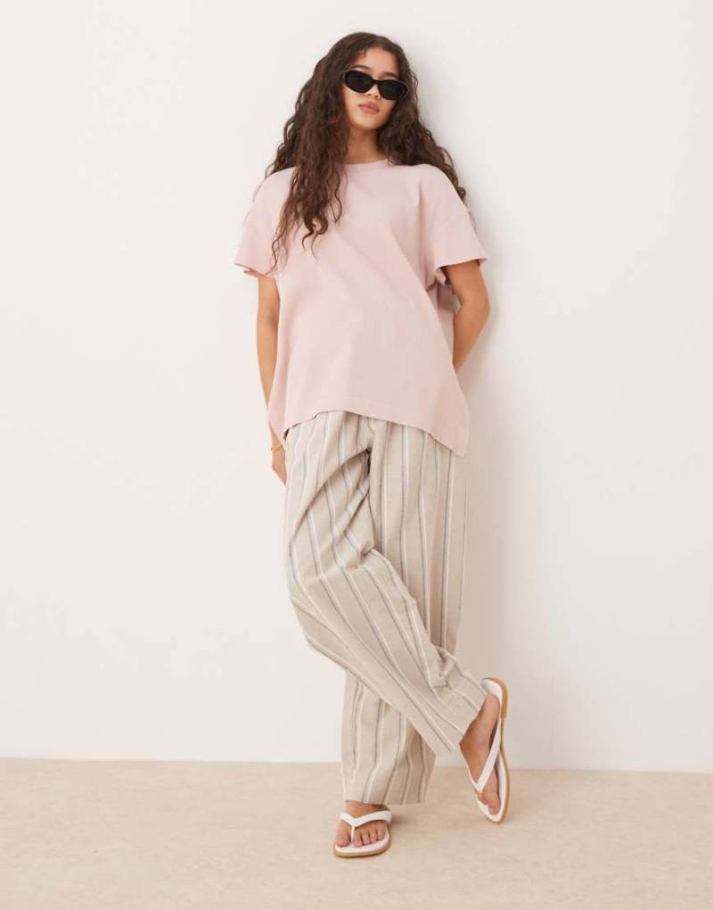 ASOS DESIGN ‒ Oversize-T-Shirt in verwaschenem Roa mit Waffelstruktur mit sehr breitem Saum-Rosa von ASOS DESIGN