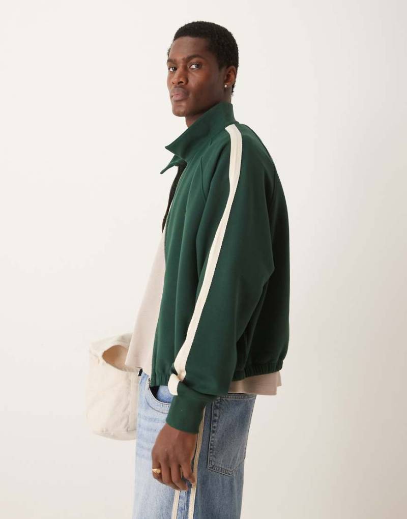 ASOS DESIGN - Oversize-Trainingsjacke in Dunkelgrün mit Raglanärmeln und kurzem Schnitt von ASOS DESIGN