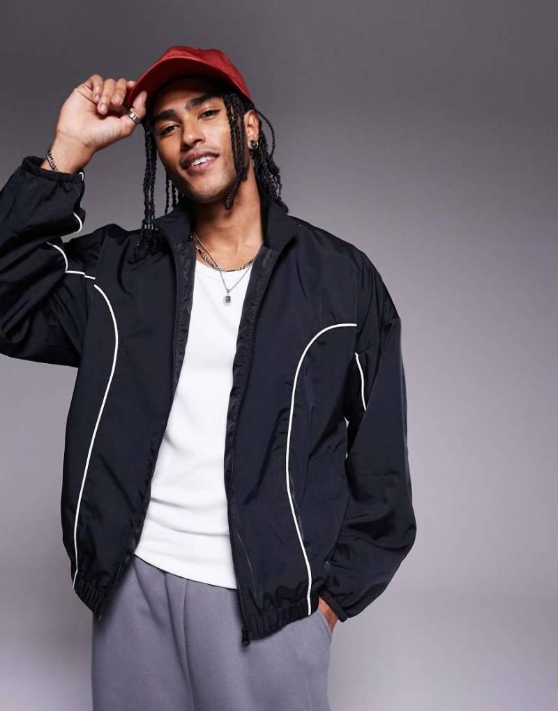 ASOS DESIGN - Oversize-Trainingsjacke in Schwarz mit farblich abgesetzter Paspelierung von ASOS DESIGN