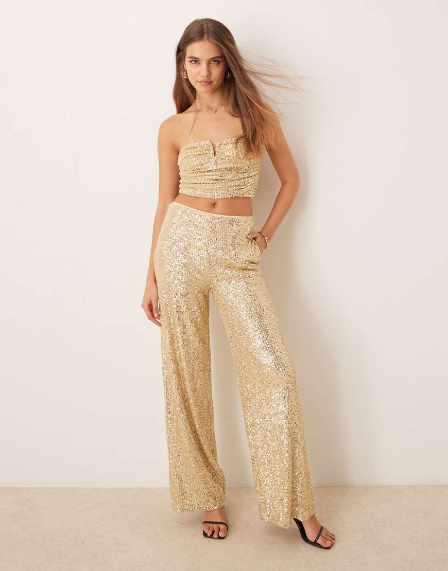 ASOS DESIGN - Pailletten-Hose in Gold mit weitem Schnitt, Kombiteil-Goldfarben ASOS DESIGN - Pailletten-Hose in Gold mit weitem Schnitt, Kombiteil-Goldfarben von ASOS DESIGN
