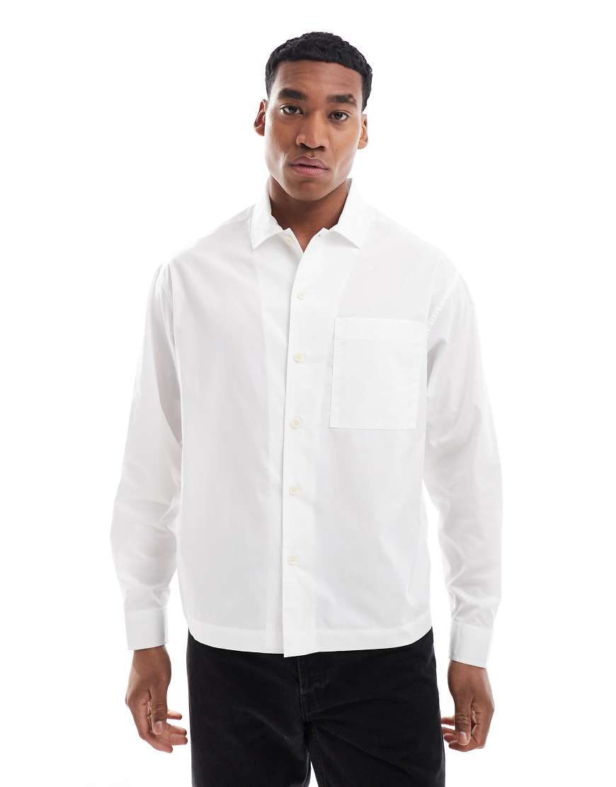 ASOS DESIGN Plus -Kastiges Oversize-Hemd aus Popeline in Weiß mit Knopfleiste ASOS DESIGN Plus -Kastiges Oversize-Hemd aus Popeline in Weiß mit Knopfleiste von ASOS DESIGN
